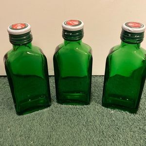 Set of three Jäegermeister green bottles with caps